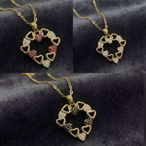 A gold heart-link pendant necklace displayed in a three-panel collage on a dark textured fabric background. The necklace features multiple small heart-shaped links, some adorned with clear rhinestones and others with pink, green, or silver-toned rhinestones.