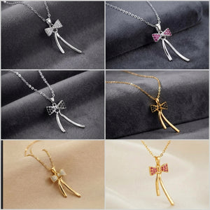 Six-panel collage showing bow-shaped pendant necklaces in silver and gold tones, each with a delicate chain and a bow detail set with clear stones or pink rhinestones, displayed on dark gray and beige fabric backgrounds.