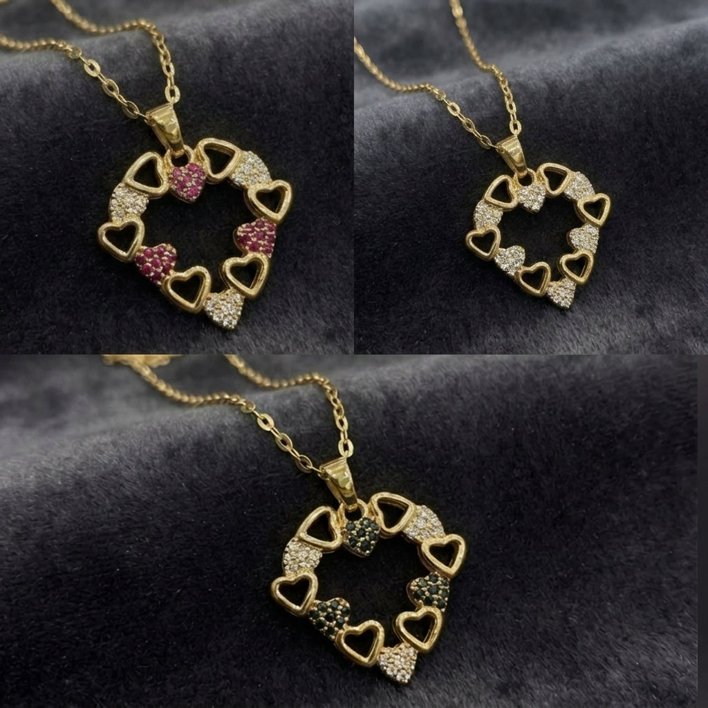 A gold heart-link pendant necklace displayed in a three-panel collage on a dark textured fabric background. The necklace features multiple small heart-shaped links, some adorned with clear rhinestones and others with pink, green, or silver-toned rhinestones.